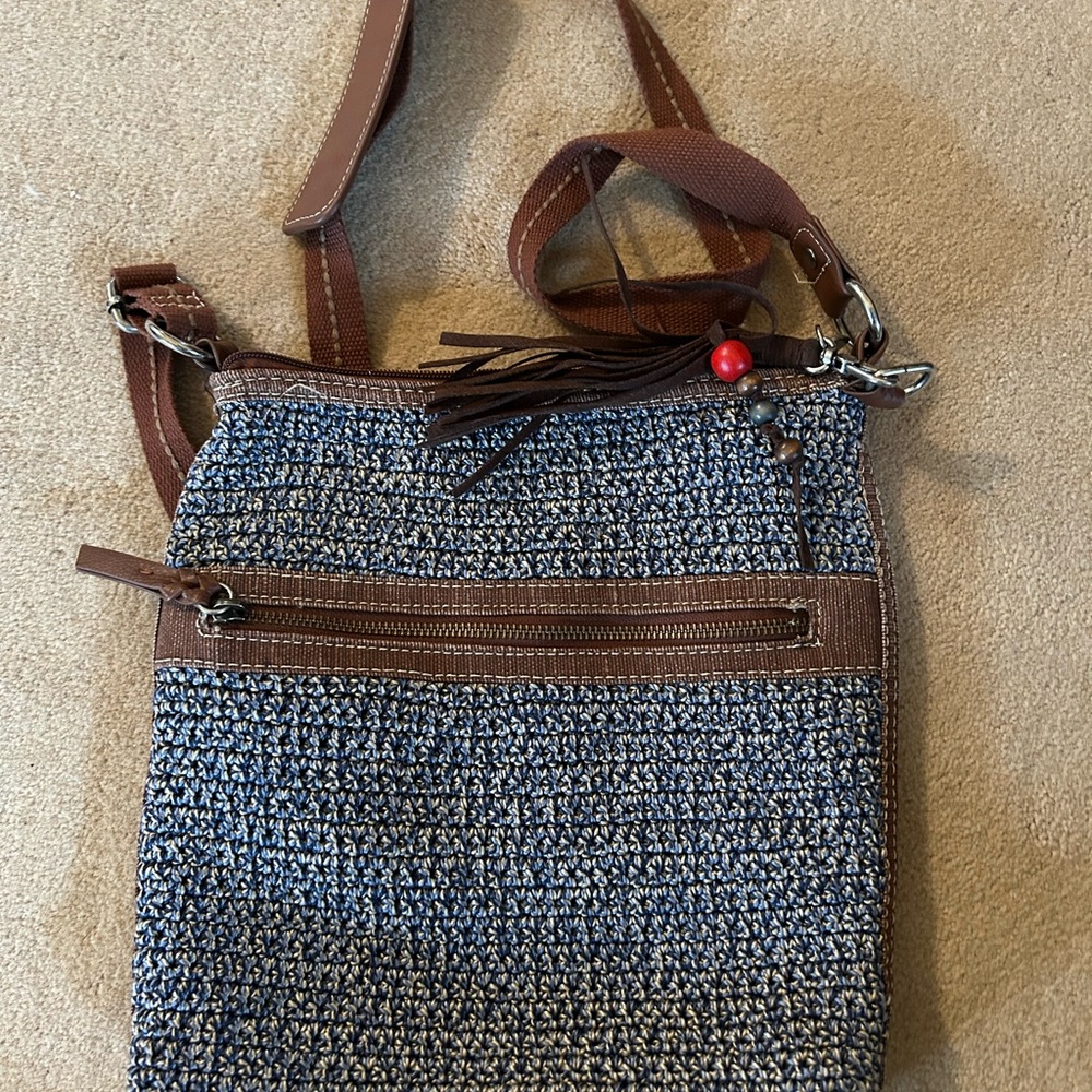 The SAK crochet crossbody blue/beige 11” by 13”.